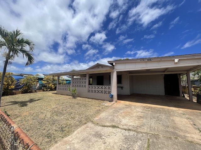 4548 Kawailoa St, Kekaha, HI 96752 - view of front of house featuring concrete driveway, covered porch, and an attached carport
