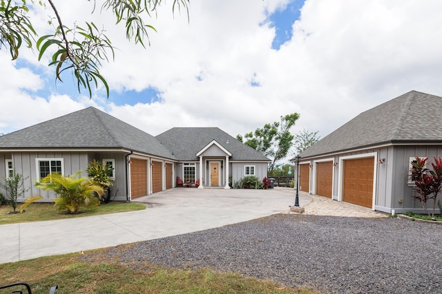 71-1861 Puu Lani Loop, Kailua-Kona, HI 96740 - single story home with concrete driveway, a garage, board and batten siding, and a shingled roof