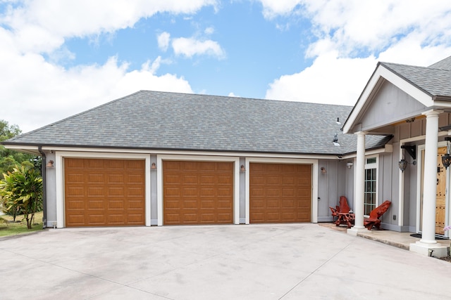 71-1861 Puu Lani Loop, Kailua-Kona, HI 96740 - view of front of home with driveway, roof with shingles, a garage, and board and batten siding