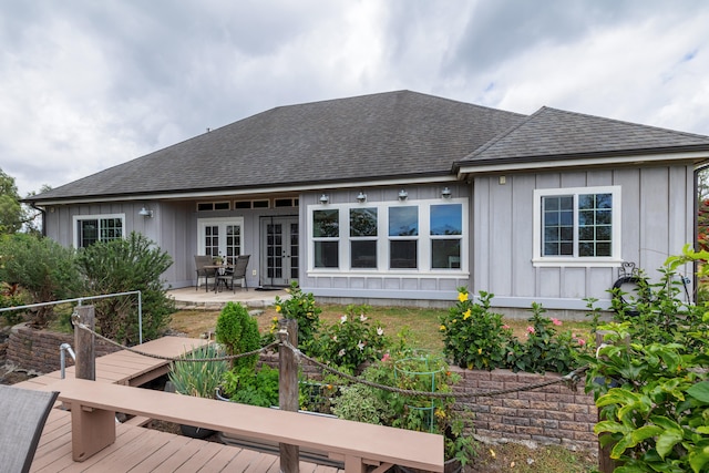 71-1861 Puu Lani Loop, Kailua-Kona, HI 96740 - rear view of property with french doors, roof with shingles, board and batten siding, and a patio area