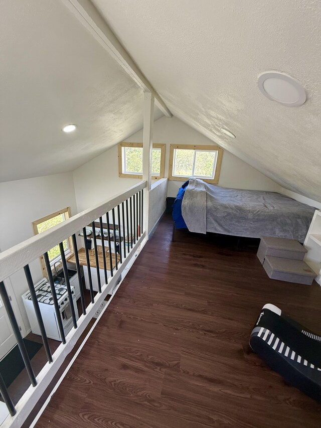 94 Pele St, Naalehu, HI 96772 - bedroom featuring wood finished floors, vaulted ceiling, a textured ceiling, and recessed lighting
