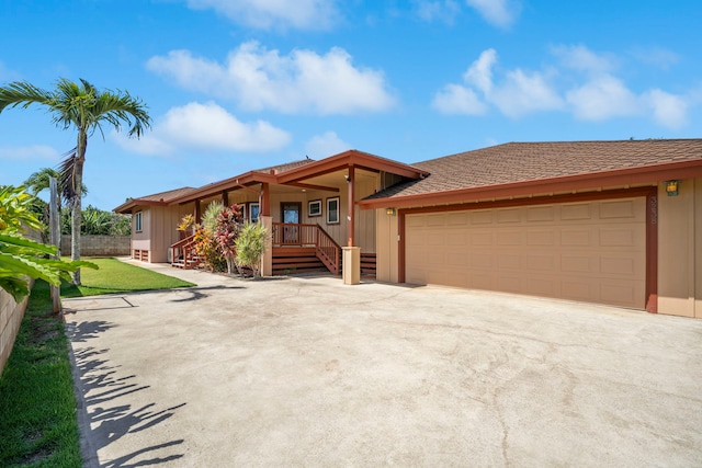 3238 Unahe St, Lihue, HI 96766 - view of front of property featuring an attached garage, driveway, board and batten siding, and roof with shingles