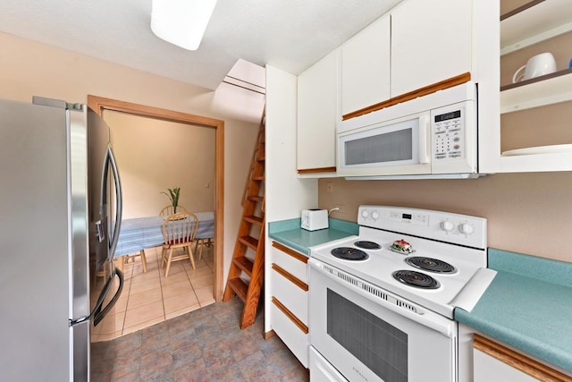 1436 Maikalani St, Hilo, HI 96720 - kitchen with white appliances, white cabinets, and glass insert cabinets