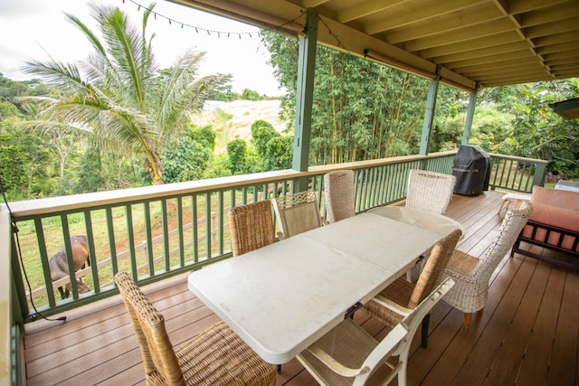 5565-D Hauiki Rd, Kapaa, HI 96746 - wooden deck with a grill and outdoor dining area