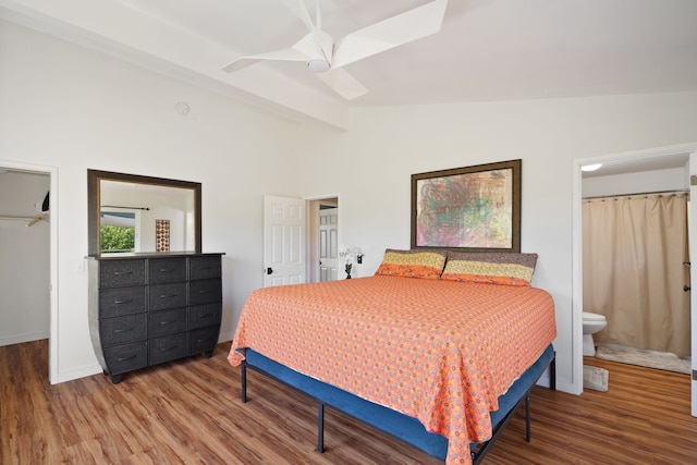 6100 Kawaihau Rd, Kapaa, HI 96746 - bedroom featuring wood finished floors, a closet, connected bathroom, a spacious closet, and ceiling fan