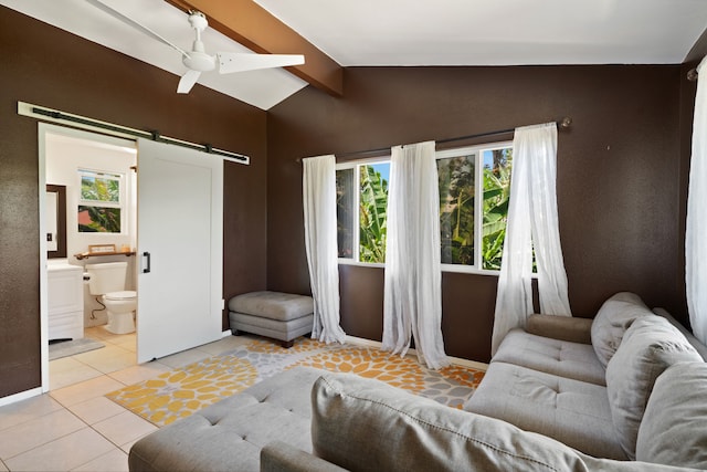 6100 Kawaihau Rd, Kapaa, HI 96746 - living room with a barn door, light tile patterned floors, and ceiling fan