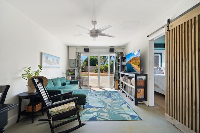 6100 Kawaihau Rd, Kapaa, HI 96746 - living area featuring a ceiling fan, finished concrete flooring, and a barn door