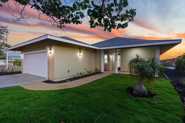 68-3543 Aaka Pl, Waikoloa, HI 96738 - mid-century inspired home with an attached garage, stucco siding, a yard, and concrete driveway