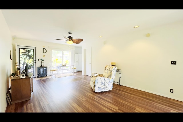 15-2811 Manalo St, Pahoa, HI 96778 - sitting room with wood finished floors, a ceiling fan, a wood stove, and recessed lighting