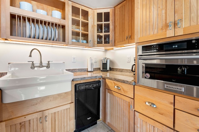75-5719 Kona Plz Unit 203, Kailua-Kona, HI 96740 - kitchen featuring black dishwasher, oven, glass insert cabinets, and light brown cabinetry