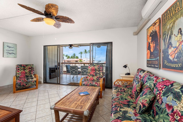 75-5719 Kona Plz Unit 203, Kailua-Kona, HI 96740 - living room with light tile patterned flooring, a ceiling fan, a wall mounted AC, and a textured ceiling