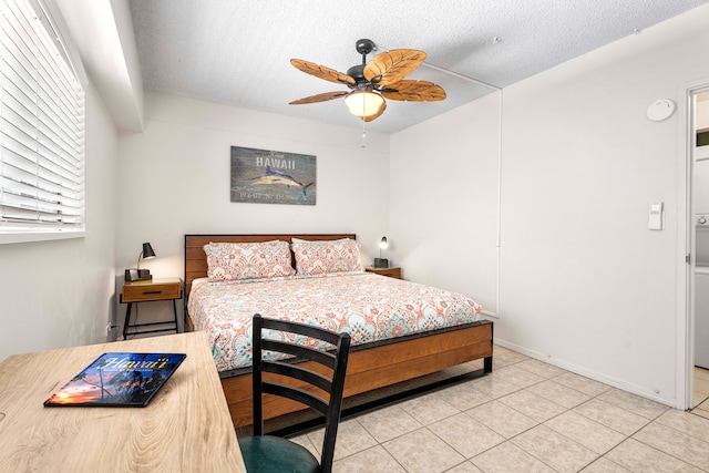 75-5719 Kona Plz Unit 203, Kailua-Kona, HI 96740 - bedroom with light tile patterned floors, a textured ceiling, and a ceiling fan