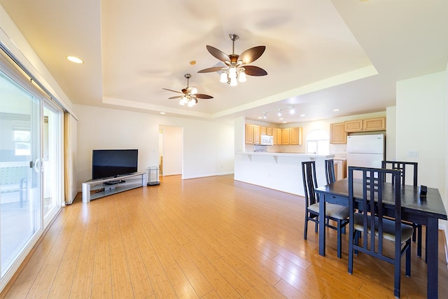 321 Noelani Loop, Hilo, HI 96720 - dining space featuring a raised ceiling, a ceiling fan, light wood finished floors, and recessed lighting