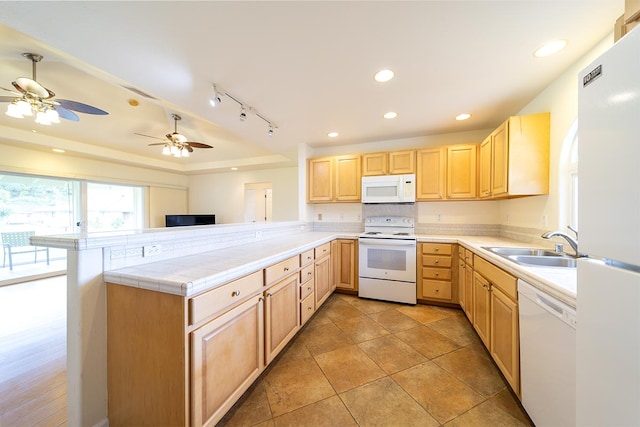 321 Noelani Loop, Hilo, HI 96720 - kitchen with white appliances, light brown cabinetry, a peninsula, rail lighting, and ceiling fan