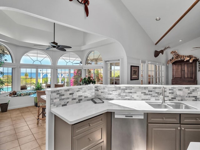 59-380 Olomana Rd, Kamuela, HI 96743 - kitchen with stainless steel dishwasher, gray cabinets, light countertops, ceiling fan, and backsplash
