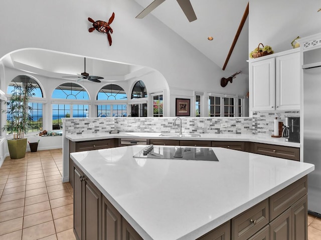 59-380 Olomana Rd, Kamuela, HI 96743 - kitchen featuring ceiling fan, appliances with stainless steel finishes, backsplash, light countertops, and high vaulted ceiling