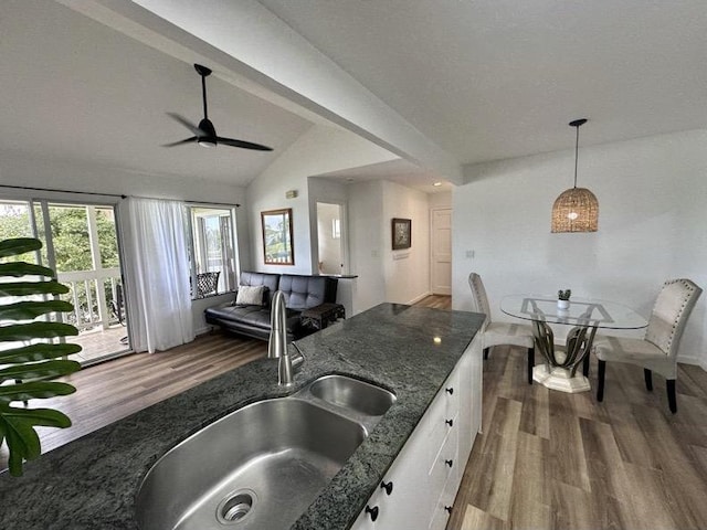 68-3883 Lua Kula St Unit 707, Waikoloa, HI 96738 - kitchen with dark wood-style flooring, white cabinets, ceiling fan, and plenty of natural light
