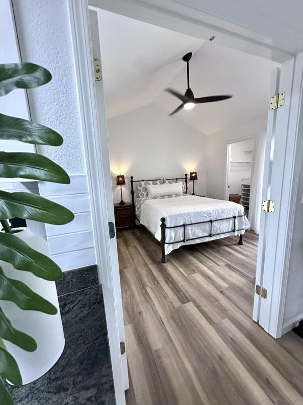 68-3883 Lua Kula St Unit 707, Waikoloa, HI 96738 - bedroom featuring wood finished floors and vaulted ceiling