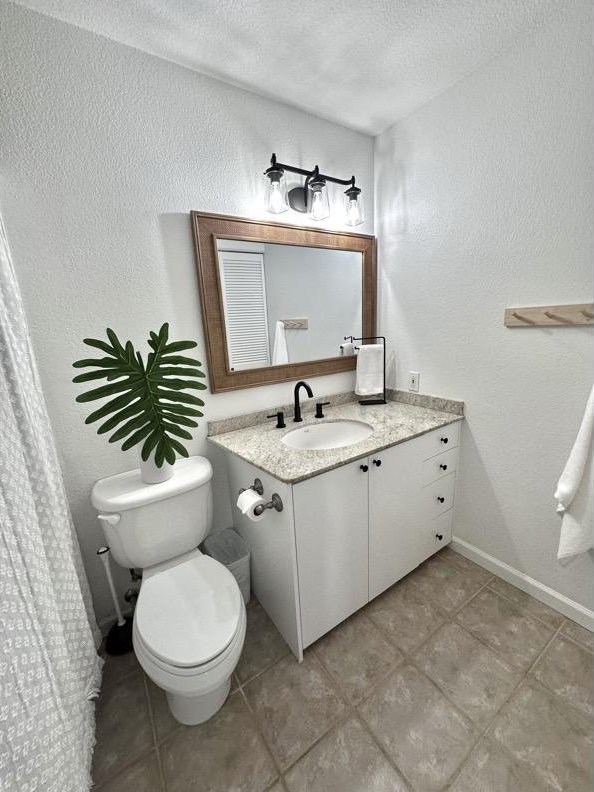68-3883 Lua Kula St Unit 707, Waikoloa, HI 96738 - bathroom featuring vanity, tile patterned floors, a textured wall, and a textured ceiling