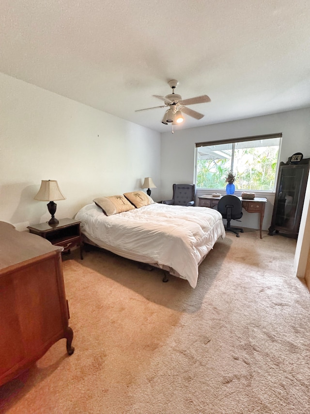 73-1259 Melomelo St, Kailua-Kona, HI 96740 - bedroom featuring light colored carpet, a desk, and ceiling fan
