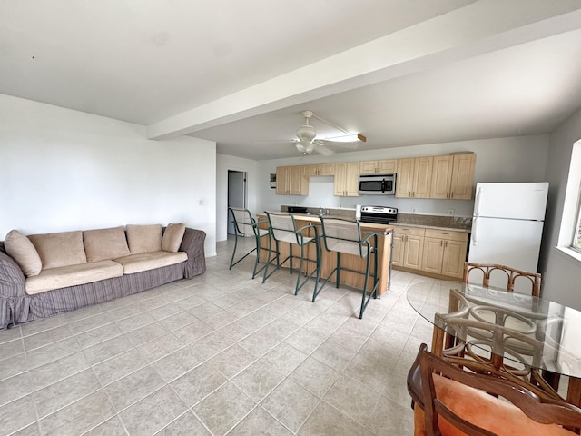73-1259 Melomelo St, Kailua-Kona, HI 96740 - kitchen with freestanding refrigerator, stainless steel microwave, electric range oven, open floor plan, and light brown cabinetry