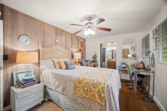 147 Royal Dr, Kapaa, HI 96746 - bedroom featuring wooden walls, an office area, wood finished floors, a ceiling fan, and ensuite bathroom