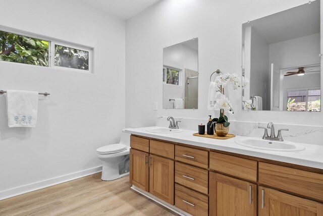 68-1685 Alana St, Waikoloa, HI 96738 - bathroom with double vanity, an enclosed shower, wood finished floors, and ceiling fan