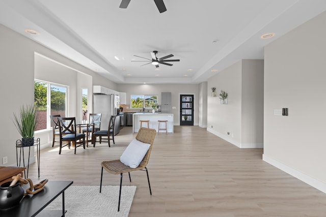 15-1628 Loke Rd, Keaau, HI 96749 - living area featuring a ceiling fan, light wood-type flooring, a tray ceiling, and recessed lighting