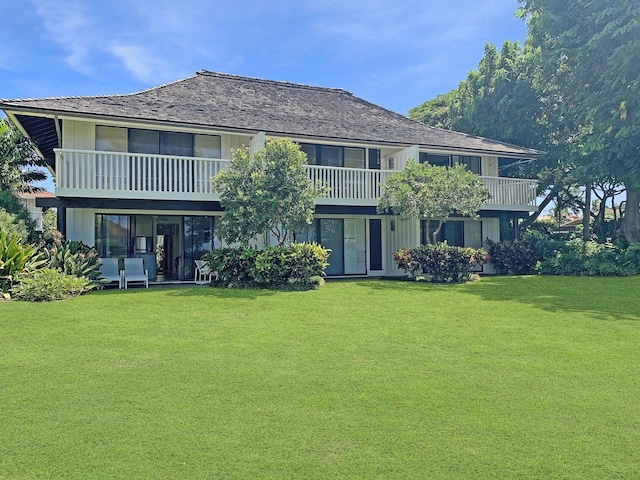 2253 Poipu Rd Unit 28, Koloa, HI 96756 - back of property featuring a lawn and a balcony