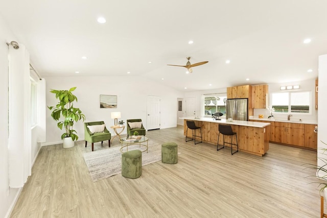 25-228 Hana St, Hilo, HI 96720 - living area with light wood-style floors, vaulted ceiling, recessed lighting, and ceiling fan