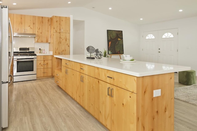 25-228 Hana St, Hilo, HI 96720 - kitchen featuring gas stove, light brown cabinetry, light wood-style floors, under cabinet range hood, and vaulted ceiling