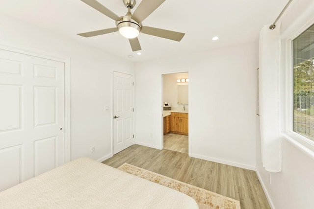 25-228 Hana St, Hilo, HI 96720 - bedroom with light wood-style flooring, recessed lighting, ensuite bathroom, and a ceiling fan