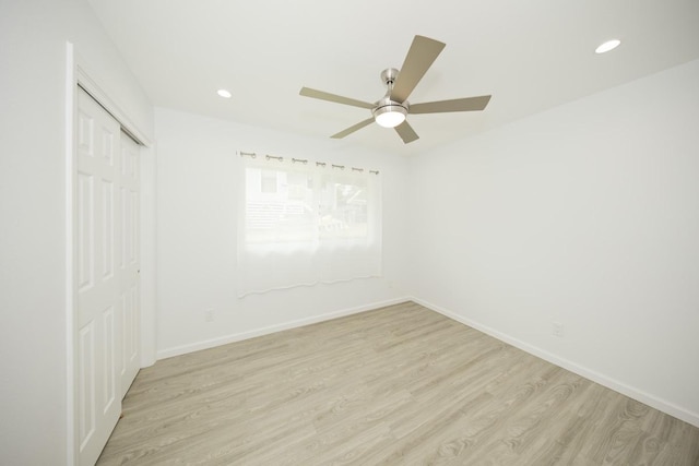 25-228 Hana St, Hilo, HI 96720 - unfurnished bedroom with light wood-style flooring, a closet, recessed lighting, and a ceiling fan