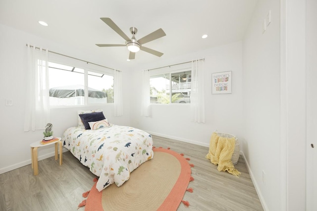 25-228 Hana St, Hilo, HI 96720 - bedroom with light wood finished floors, recessed lighting, and ceiling fan