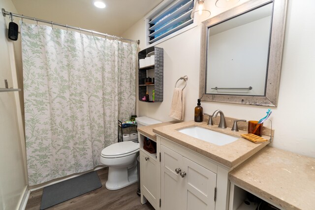 77-6452 Leilani St, Kailua-Kona, HI 96740 - full bath with wood finished floors, vanity, a shower with shower curtain, and recessed lighting