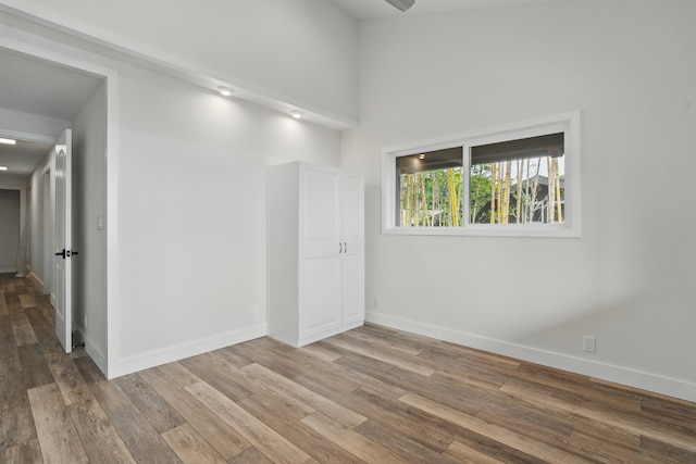 77-6452 Leilani St, Kailua-Kona, HI 96740 - unfurnished room featuring wood finished floors and a high ceiling