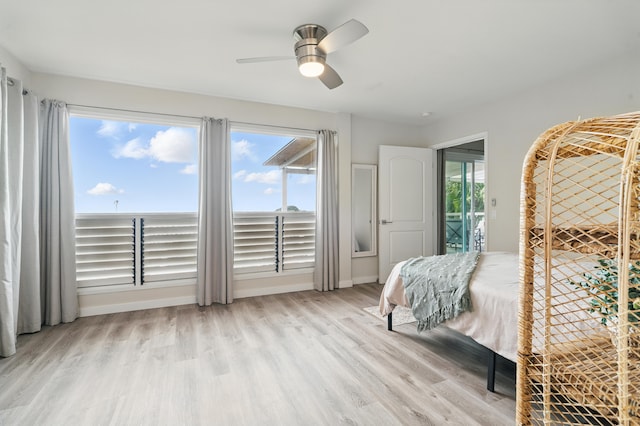 77-6452 Leilani St, Kailua-Kona, HI 96740 - bedroom with wood finished floors, multiple windows, and a ceiling fan