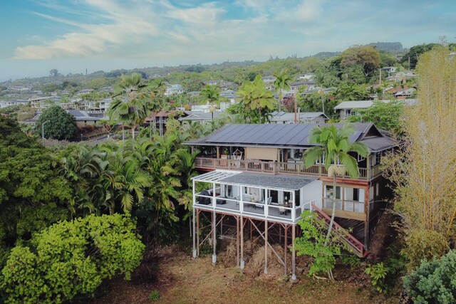 77-6452 Leilani St, Kailua-Kona, HI 96740 - rear view of property with a balcony and stairway