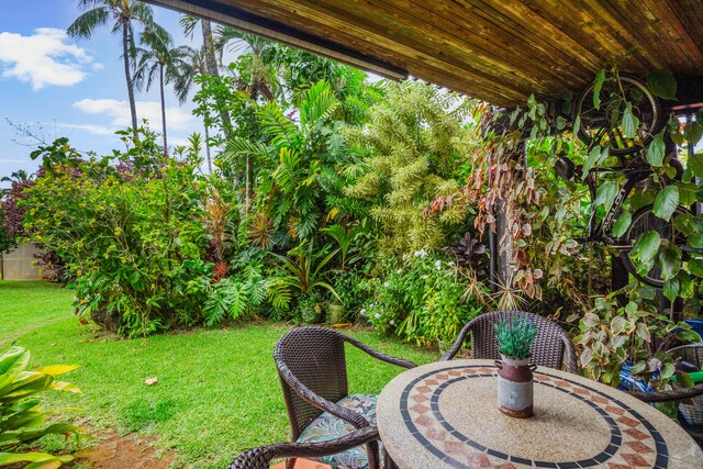 3920 Wyllie Rd Unit 6A, Princeville, HI 96722 - view of green lawn featuring a patio area