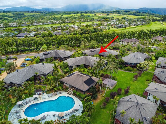 3920 Wyllie Rd Unit 6A, Princeville, HI 96722 - aerial perspective of suburban area featuring a pool and a mountainous background