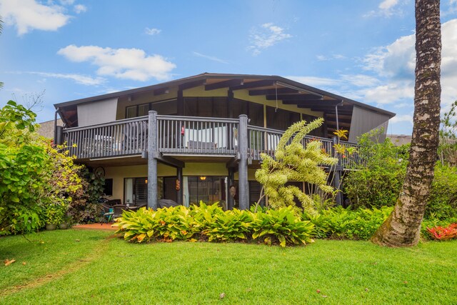 3920 Wyllie Rd Unit 6A, Princeville, HI 96722 - back of house with a lawn
