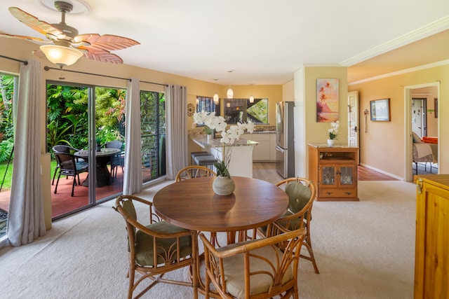 3920 Wyllie Rd Unit 6A, Princeville, HI 96722 - dining room with light colored carpet, healthy amount of natural light, a ceiling fan, and ornamental molding