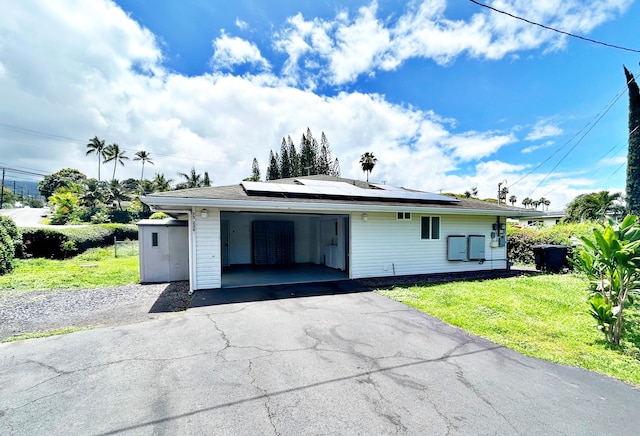 75-230 Hualalai Rd Unit B, Kailua-Kona, HI 96740 - view of front of home featuring a front yard, roof mounted solar panels, and asphalt driveway