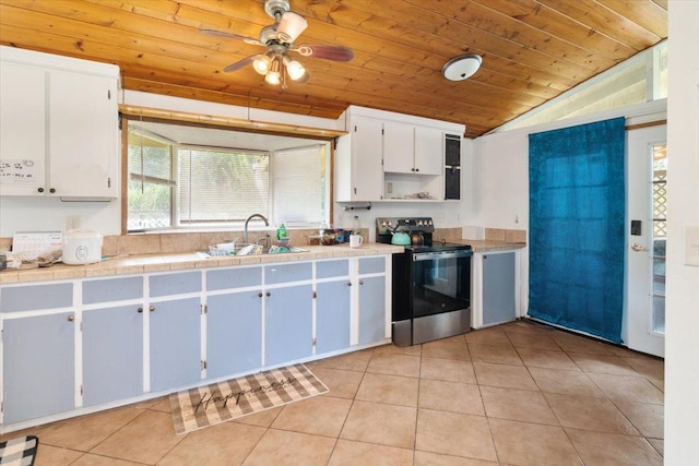 15-2775 Manalo St, Pahoa, HI 96778 - kitchen featuring stainless steel electric stove, wooden ceiling, light tile patterned flooring, vaulted ceiling, and a ceiling fan