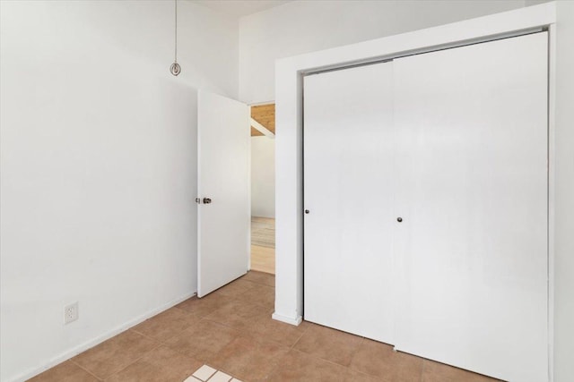 15-2775 Manalo St, Pahoa, HI 96778 - unfurnished bedroom featuring a closet and light tile patterned floors