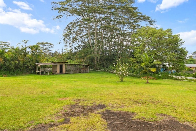 15-2775 Manalo St, Pahoa, HI 96778 - view of grassy yard featuring an outbuilding and exterior structure