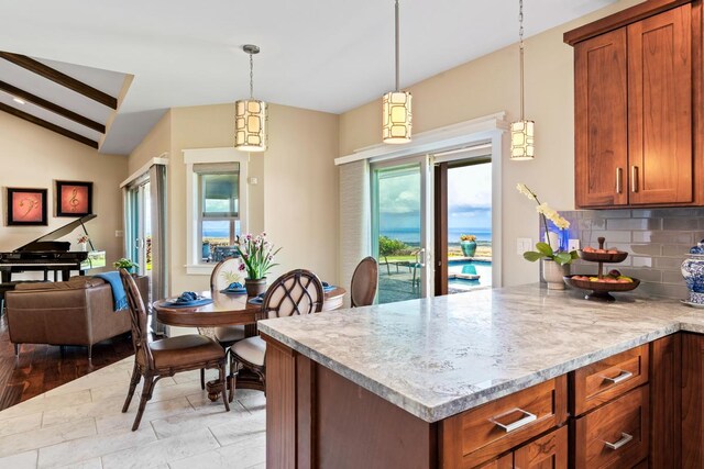 73-4366 Koikoi St, Kailua-Kona, HI 96740 - kitchen featuring vaulted ceiling, decorative backsplash, a peninsula, brown cabinets, and pendant lighting