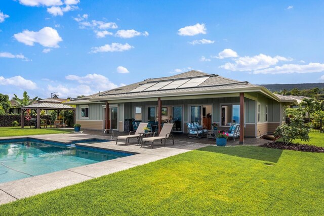 73-4366 Koikoi St, Kailua-Kona, HI 96740 - back of property with a gazebo, a patio area, board and batten siding, a lawn, and roof with shingles