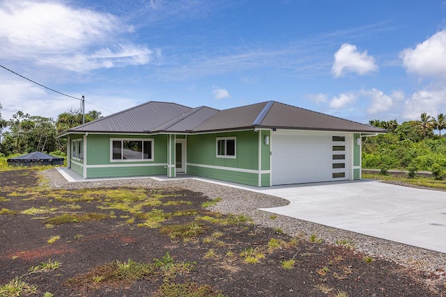 16-1653 34th Ave, Keaau, HI 96760 - view of front of property with a metal roof, concrete driveway, and a garage