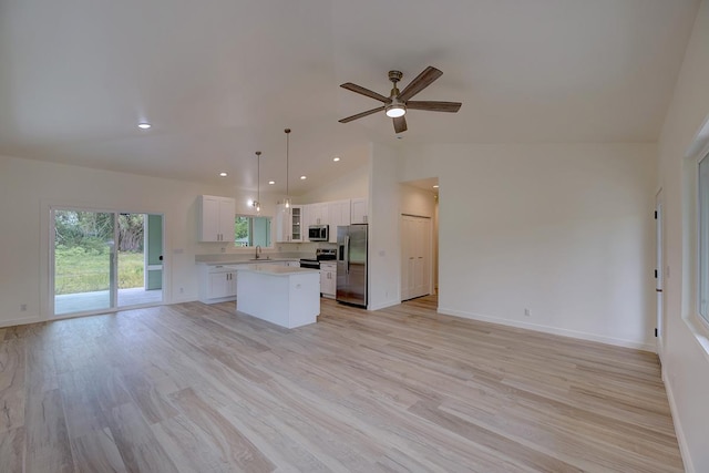 16-1653 34th Ave, Keaau, HI 96760 - kitchen with stainless steel appliances, open floor plan, a center island, light wood-style floors, and recessed lighting